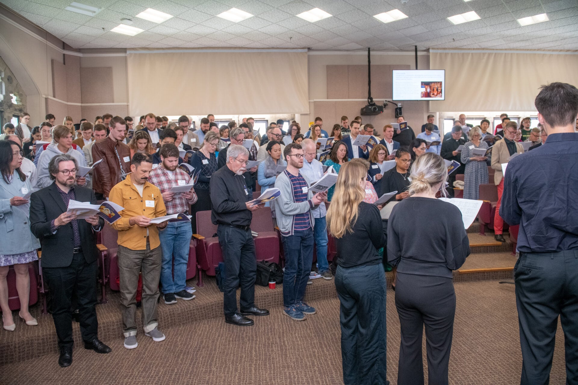 Participants singing Morning Prayer at Scala Foundation conference led by composer Paul Jernberg